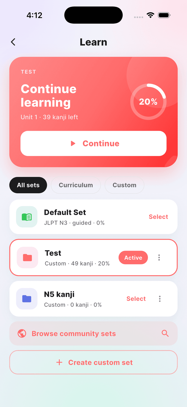 The kanji Learn screen: a coral Continue learning card showing Unit 1 with 39 kanji left and a 20 percent progress ring, above a list of study sets.
